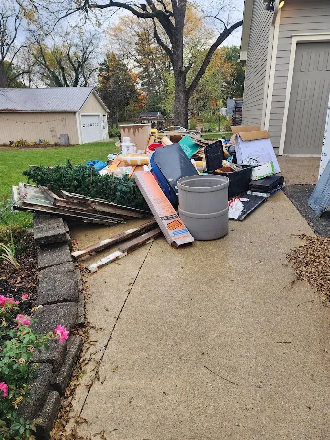 Dumpster being loaded with debris for 30 Yard Dumpster Rental in Saratoga